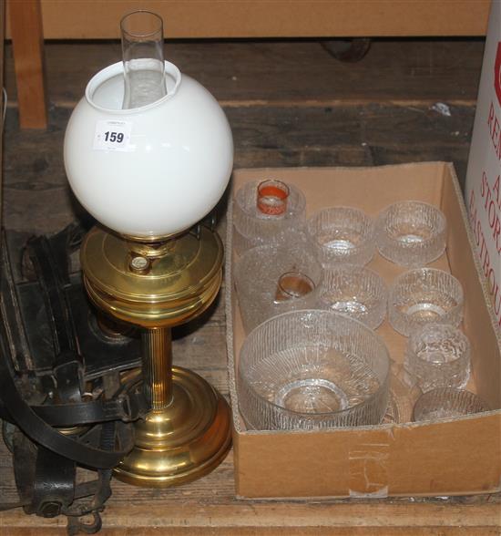 A brass and glass oil lamp